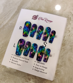 A set of colorful press-on nails displayed on a white retail card labeled 'Nail Lounge,' photographed on a light marble-like surface.